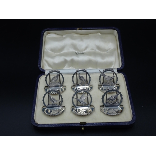 104 - A Set of six George V silver Menu Holders in the form of game birds, including pheasant, partridge, ... 