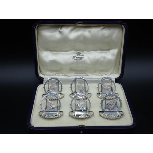 104 - A Set of six George V silver Menu Holders in the form of game birds, including pheasant, partridge, ... 