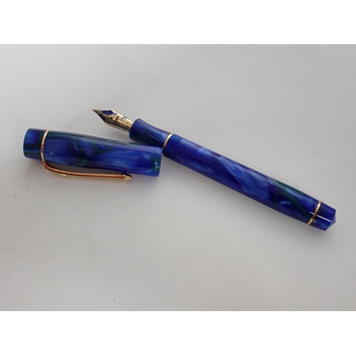 117 - A Conway Stewart Fountain Pen with 18k nib in petrol blue and green case