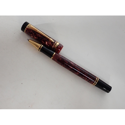 118 - A Parker Duofold Roller Ball Pen in purple marble effect case