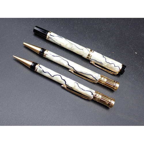 119 - A Parker Duofold Roller Ball Pen in pearl and black case, and a matching Propelling Pencil and Fount... 