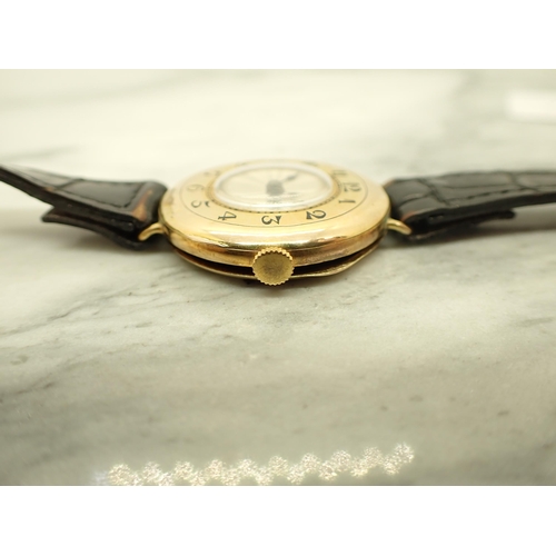 136 - An early 20th Century Rolex manual Wristwatch in a half-hunter style the circular dial with ivory co... 