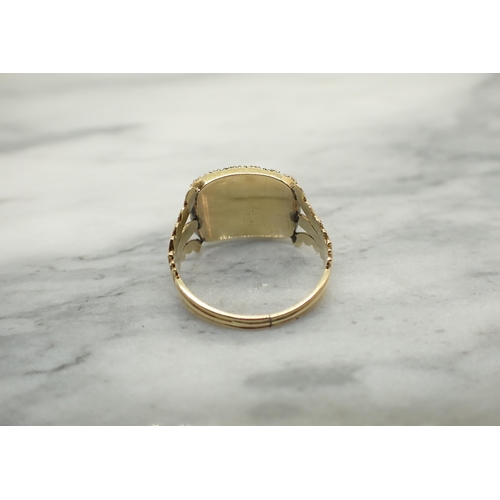 140 - A Georgian Mourning Ring having rectangular panel of plaited hair within frame of split pearls, ring... 