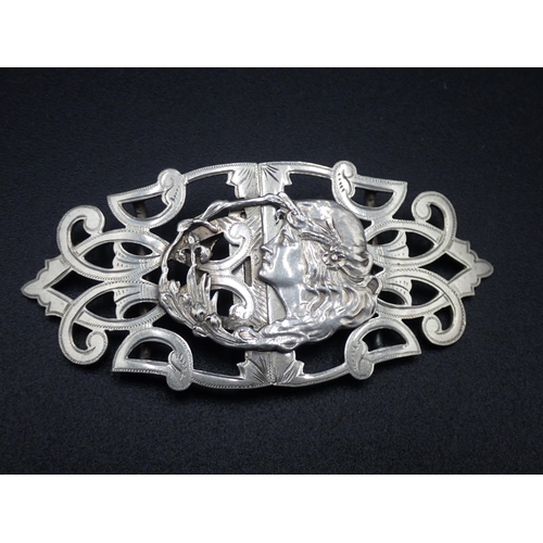 15 - An Edward VII silver two part Art Nouveau Nurse's Buckle with female head and pierced scrolls, Chest... 