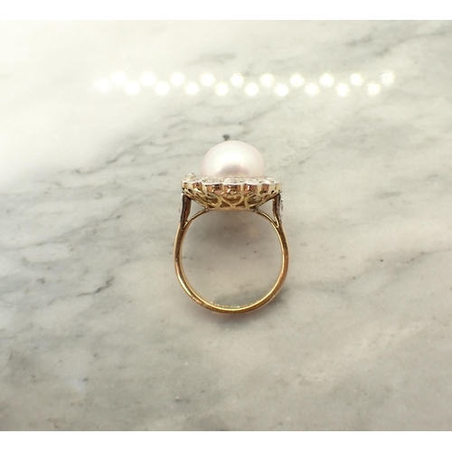 151 - A Cultured Pearl and Diamond Cluster Ring the pale rosé pearl within a frame of millegrain-set old-c... 