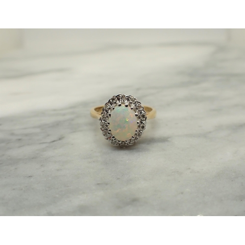 157 - An Opal and Diamond Cluster Ring claw-set oval opal cabochon within frame of eight-cut diamonds, sta... 