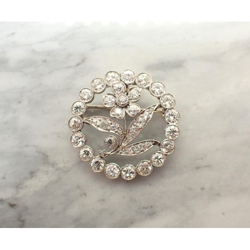 158 - An Art Deco Diamond Flower Pendant/Brooch the openwork plaque with flower in circular frame millegra... 