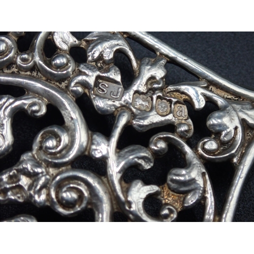 17 - A large Victorian silver two part Nurse's Buckle with mask and leafage scroll design, London 1896, m... 