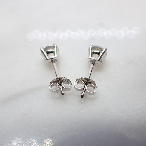 172 - A pair of Diamond Ear Studs each claw-set brilliant-cut stone , total diamond weight 1.01cts, in 18c... 