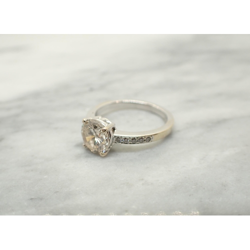 178 - A Diamond Ring claw-set brilliant-cut stone, estimated 1.40cts, with rows of smaller stones pavé-set... 