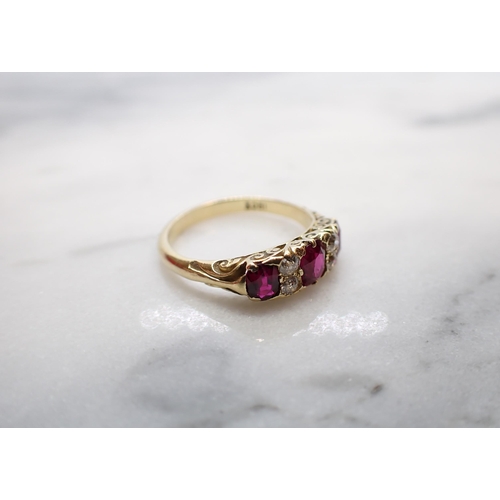 184 - A Ruby and Diamond Ring pavé-set three graduated oval-cut rubies interspersed with pairs of old-cut ... 