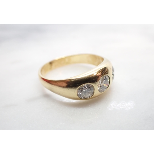 188 - A Diamond three stone Ring gypsy-set graduated brilliant-cut stones (centre stone chipped), stamped ... 