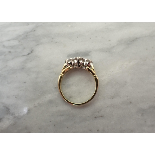 194 - A Diamond three stone Ring claw-set graduated brilliant-cut stones in 18ct gold, ring size J 1/2, ap... 