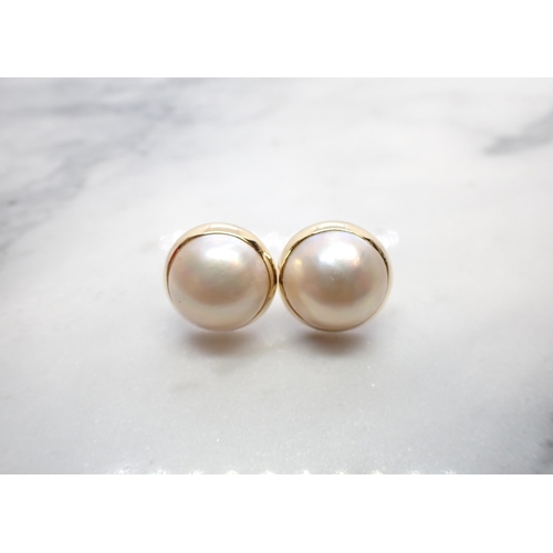 206 - A pair of Mabé Pearl Earrings, one lacks butterfly back