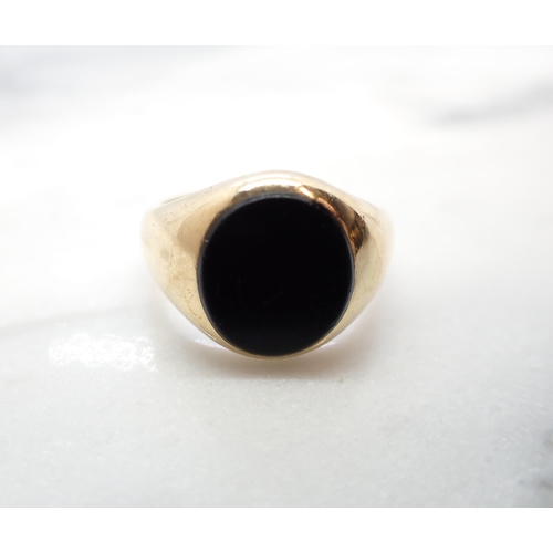 207 - A 9ct gold Signet Ring set oval black onyx, ring size N, approx 6.50gms