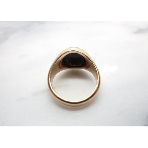 207 - A 9ct gold Signet Ring set oval black onyx, ring size N, approx 6.50gms