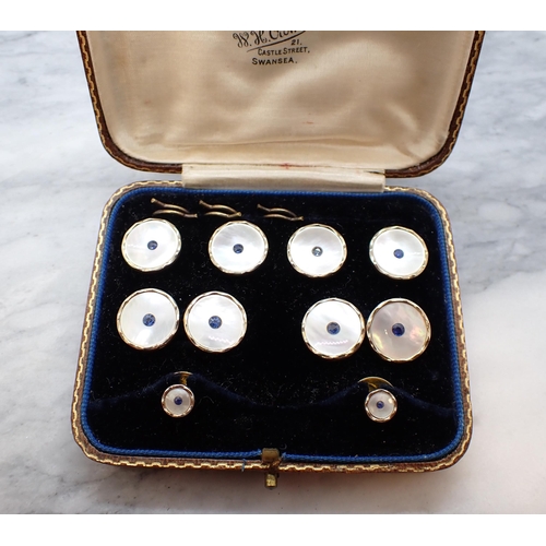 210 - A set of Dress Studs, Cufflinks and Buttons each set mother of pearl with central blue stone in 9ct ... 