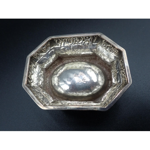 22 - A George I silver Trencher Salt with floral embossing, marks indistinct but possibly London 1719