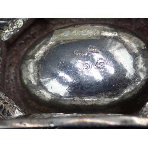 22 - A George I silver Trencher Salt with floral embossing, marks indistinct but possibly London 1719