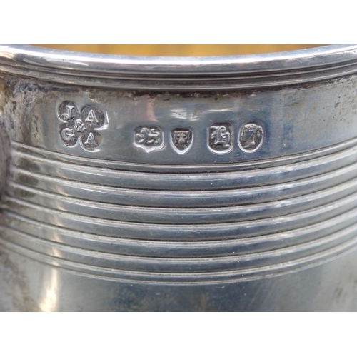 24 - A Victorian silver Mug of reeded form, scroll handle, engraved 'Premium from the Herefordshire Agric... 