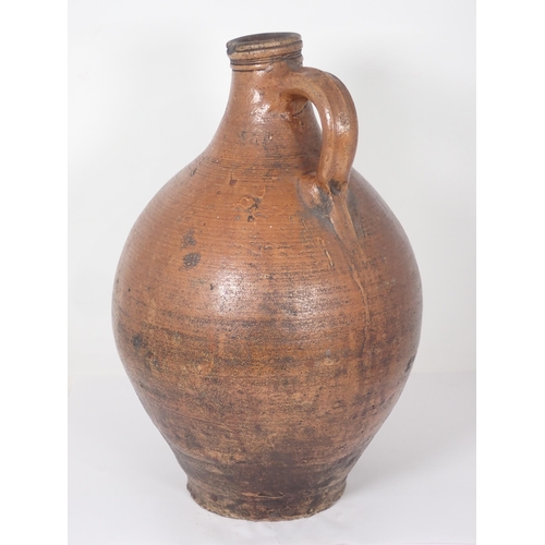 287 - A 17th Century stoneware salt glazed Bellarmine Wine Jug with orange tiger glaze and mask decoration... 