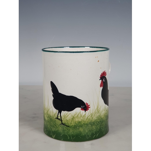 297 - A Wemyss Ware large Mug, decorated chickens, with green rim and handle, 5½in H, impressed mark and o... 