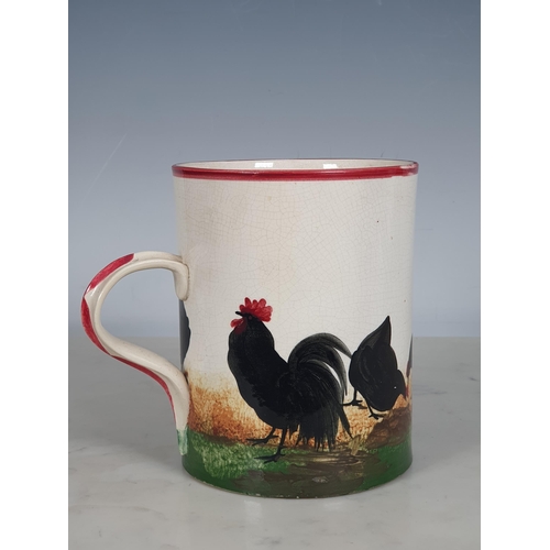 298 - A Wemyss Ware large Mug, decorated chickens, with puce rim and handle, 5¾in H, A/F, impressed mark t... 