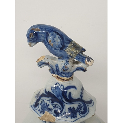 313 - A pair of 19th Century Dutch delft lidded Vases with bird finials and panels of boy fishing A/F 12in... 