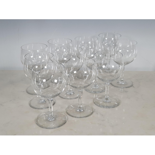 316 - A set of eleven Baccarat Wine Glasses in the Paris goblet style with panel cut stems and acid etched... 