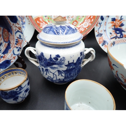 320 - Two Chinese Imari Plates painted landscape and flowering shrubs in iron red and blue, 9in, two imari... 