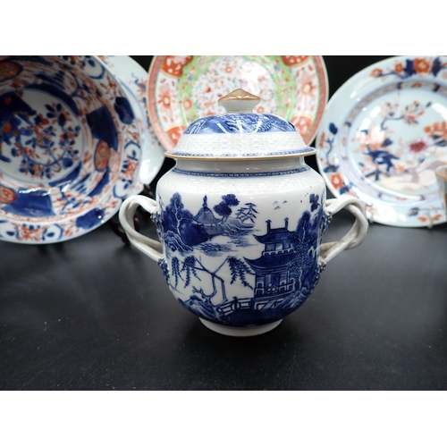 320 - Two Chinese Imari Plates painted landscape and flowering shrubs in iron red and blue, 9in, two imari... 