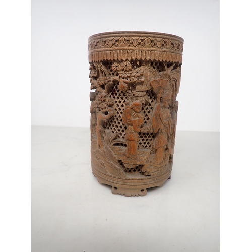 325 - An Oriental bamboo Brush Pot, finely carved and pierced with figures in a landscape, 6in