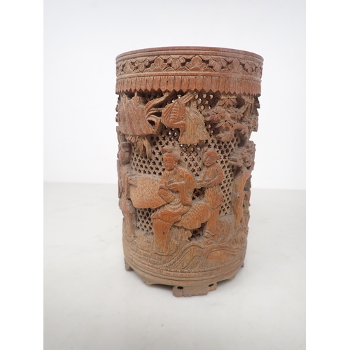 325 - An Oriental bamboo Brush Pot, finely carved and pierced with figures in a landscape, 6in