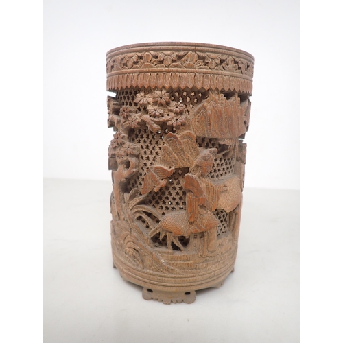 325 - An Oriental bamboo Brush Pot, finely carved and pierced with figures in a landscape, 6in