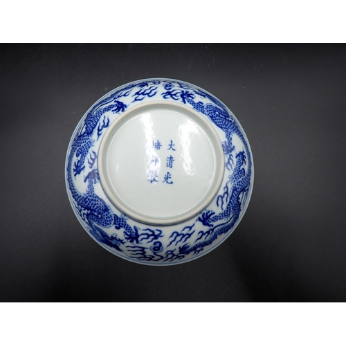 332 - A Chinese blue and white shallow Saucer Dish, painted dragon to centre and exterior, 6¾in, six chara... 