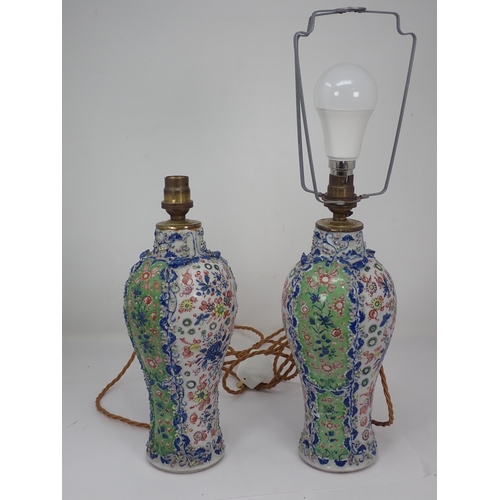 333 - A pair of Chinese ceramic baluster Vases with green and white panels with painted floral designs amo... 