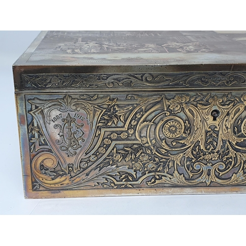 357 - A silver plated Sewing or Jewellery Box with engraved Parisian Scene to lid titled 'Le Tour est Joue... 