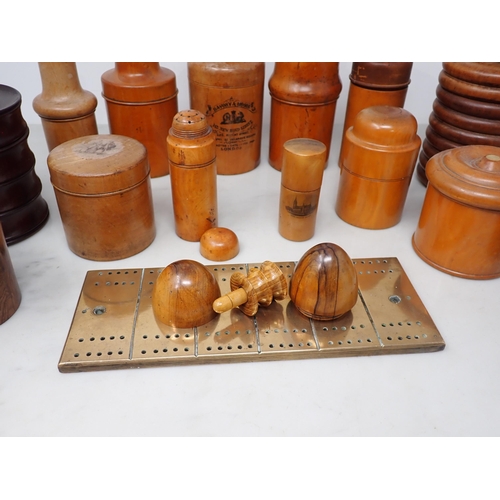 369 - A Collection of treen Bottle Holders, Jars, etc, and a brass Cribbage Board