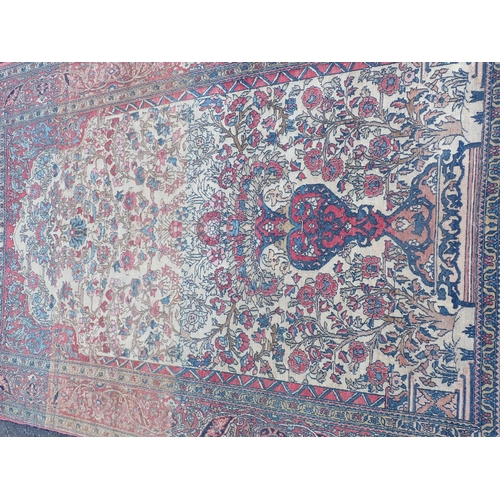 379 - A large bordered Persian Prayer Rug, the central field with vase of flowers, the main border with tr... 