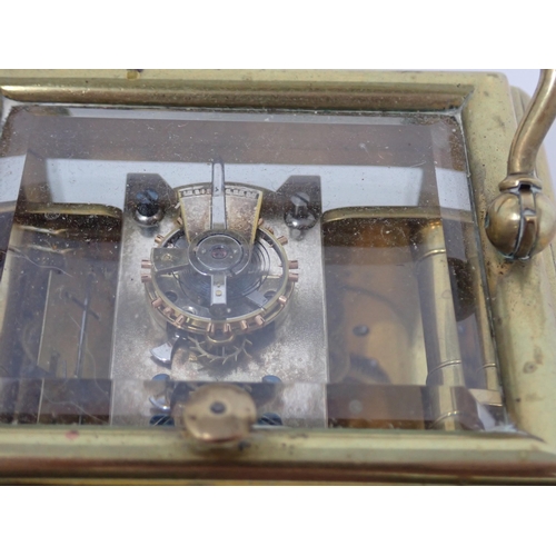 401 - A late 19th Century brass cased Carriage Clock with white enamel dial, lever escapement, hour repeat... 