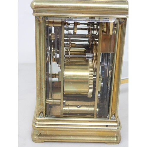 401 - A late 19th Century brass cased Carriage Clock with white enamel dial, lever escapement, hour repeat... 