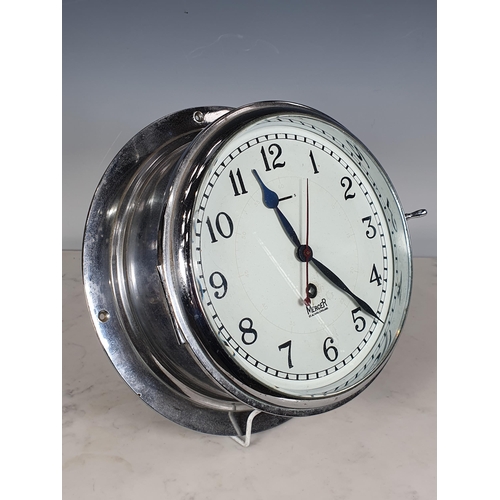 408 - A chrome cased 8-day Ship's Clock by Mercer, St Albans, England, the circular dial marked with Arabi... 