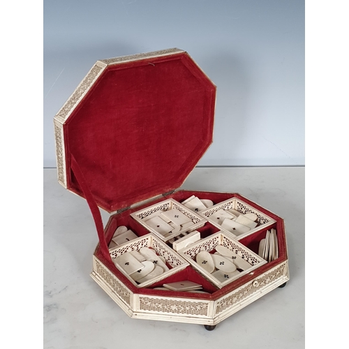 422 - A 19th Century Russian Bone Games Box with hinged octagonal cover, said to be made in Arkangel, cont... 