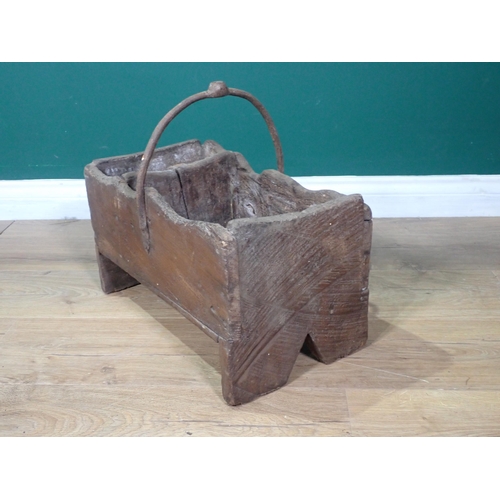 434 - An antique primitive elm Farrier's Box of boarded construction with iron handle on v-cut end support... 