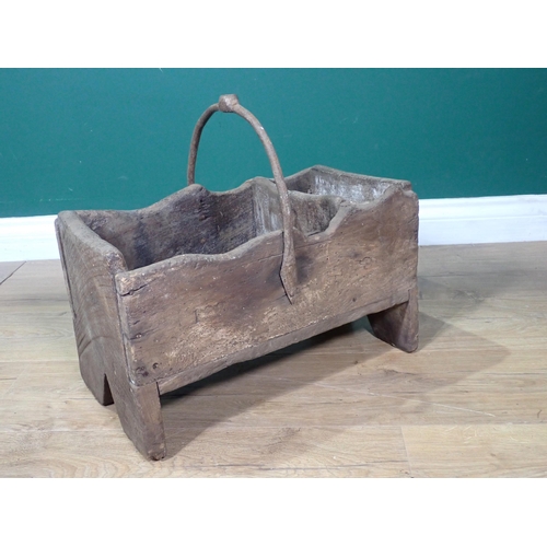 434 - An antique primitive elm Farrier's Box of boarded construction with iron handle on v-cut end support... 