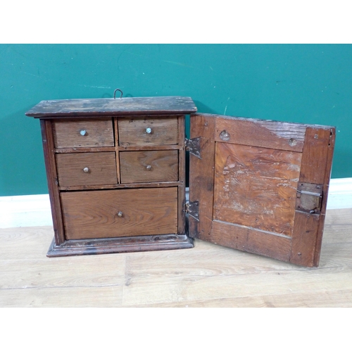 439 - An 18th Century burr elm and oak Spice Cupboard, the single door having raised burr elm panel enclos... 