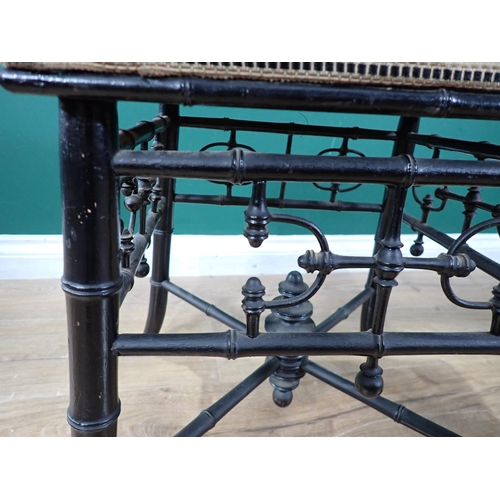 448 - A 19th Century ebonised upholstered Stool with turned and open frieze, raised on simulated bamboo sp... 