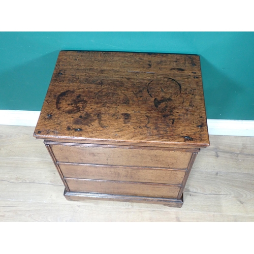 450 - An early 18th Century oak Box Stool/Commode with hinged lid above three simulated drawers on bracket... 