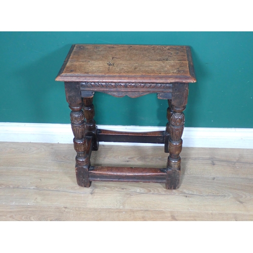 451 - An Elizabethan style oak Joint Stool with carved and shaped frieze raised on turned and carved cup a... 