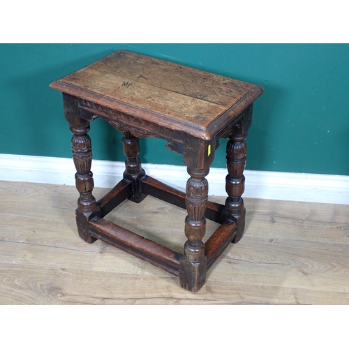 451 - An Elizabethan style oak Joint Stool with carved and shaped frieze raised on turned and carved cup a... 